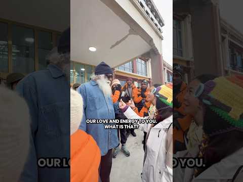 Two Chinese devotees offer their “hearts” to Sadhguru.